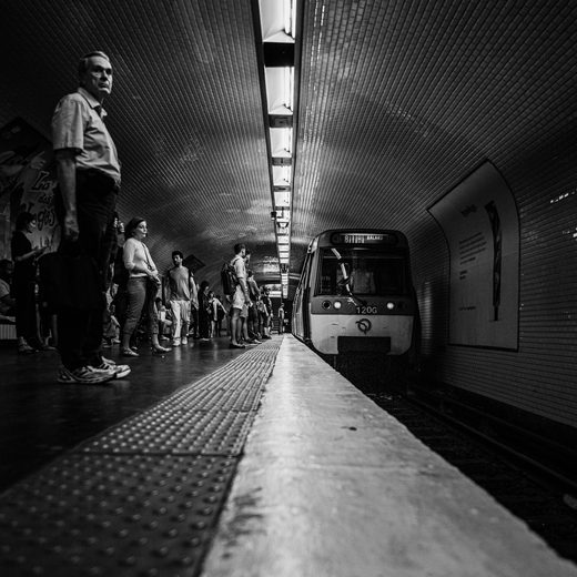 Commuters waiting on an underground platform